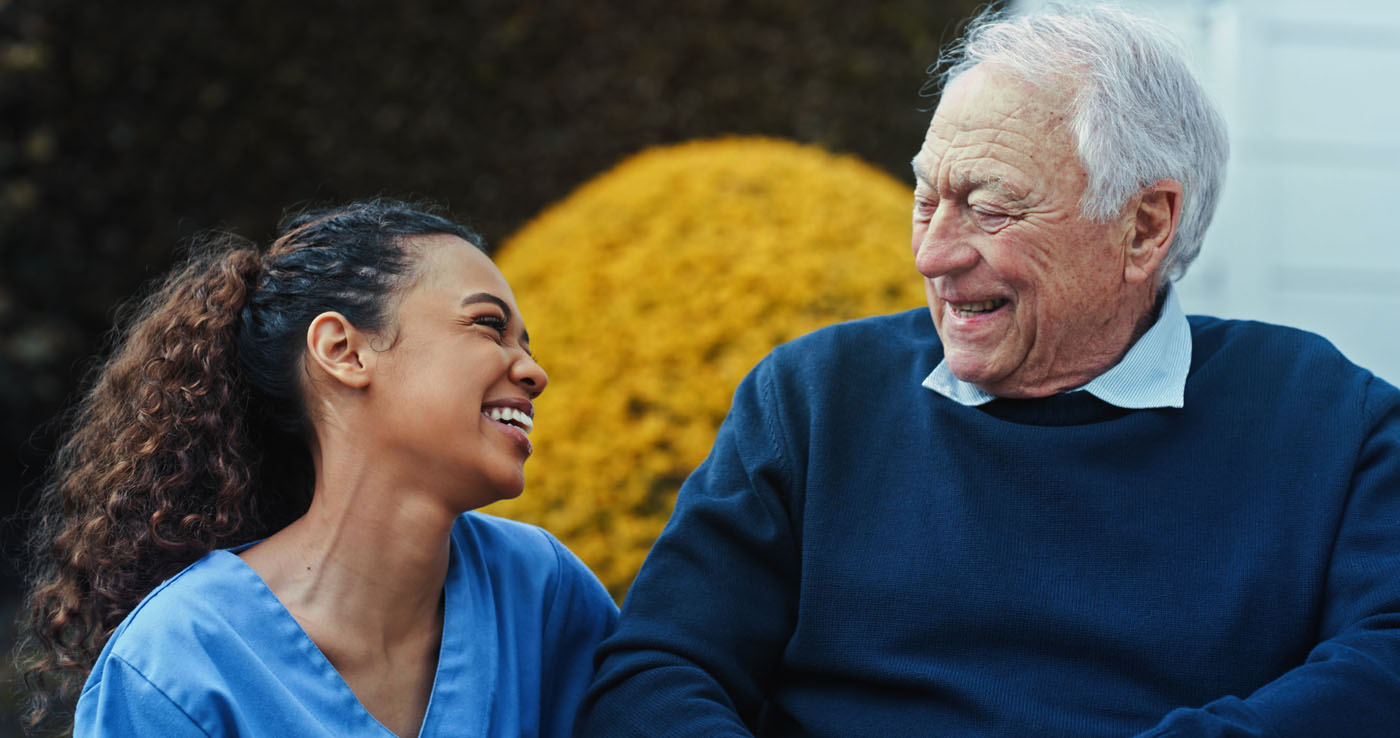 Shot of an attractive young nurse bonding with her senior patient in the garden